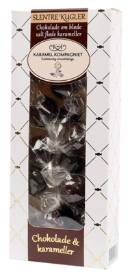 En flot æske med runde kugler af mørk chokolade. Flot indpakket i hånden.